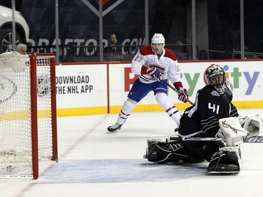 Montreal Canadiens centre Alex Galchenyuk (27) watches a shot by teammate Nathan Beaulieu go past New York Islanders goalie Jaroslav Halak (41) for a goal during the first period of an NHL hockey game Friday, Nov. 20, 2015, in New York.