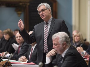 Quebec government House leader Jean-Marc Fournier responds to the Opposition  Tuesday, November 24, 2015 at the legislature in Quebec City.