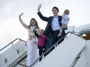 Canadian Prime Minister Justin Trudeau, Hadrien, Ella-Grace and his wife Sophie Gregoire-Trudeau board a government plane as they leave Valletta, Malta, on  Saturday, Nov. 28, 2015 Trudeau was heading to Paris for the United Nations climate change summit.