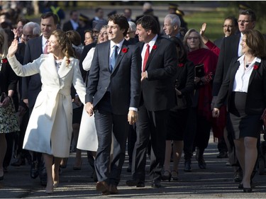 Prime Minister-designate Justin Trudeau, his wife Sophie Grégoire-Trudeau and the Members of Parliament who will comprise his cabinet arrive at Rideau Hall for a swearing-in ceremony in Ottawa on Wednesday, Nov. 4, 2015.