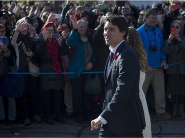 Prime Minister-designate Justin Trudeau and the Members of Parliament who will comprise his cabinet arrive at Rideau Hall for a swearing-in ceremony in Ottawa on Wednesday, Nov. 4, 2015.