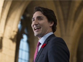 Prime Minister Justin Trudeau laughs as he speaks to the media as he walks to caucus on Parliament Hill, Thursday November 5, 2015 in Ottawa.