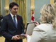 Justin Trudeau takes the oath of office as he is sworn in as prime minister at Rideau Hall in Ottawa on Wednesday, November 4, 2015.