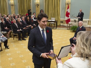 Prime Minister Justin Trudeau takes the oath of office at Rideau Hall in Ottawa on Wednesday, November 4, 2015.