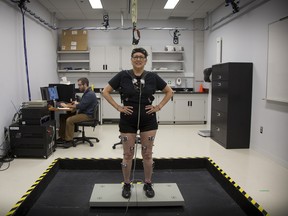 Linda Hacket is set up with wire- less EMG probes that measure muscle activity while research assistant Dan Aponte monitors her progress at Concordia’s PERFORM Centre.