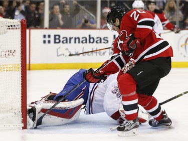 New Jersey Devils right wing Lee Stempniak (20) scores a goal on Montreal Canadiens goalie Mike Condon (39) during the second period of an NHL hockey game, Friday, Nov. 27, 2015, in Newark, N.J.