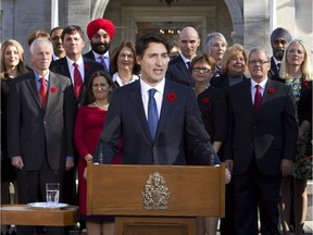 Prime Minister Justin Trudeau holds a news conference with his cabinet after they were sworn-in at Rideau Hall, the official residence of Governor General David Johnston, in Ottawa Wednesday, November 4, 2015.