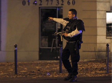A policeman guards the area of Boulevard Baumarchais after an attack in the French capital on November 13, 2015 in Paris, France.