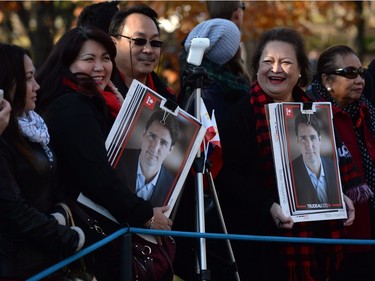 Members of the public wait on the grounds of Rideau Hall before the swearing-in ceremony ofor Prime Minister-designate Justin Trudeau in Ottawa on Wednesday, Nov. 4, 2015.