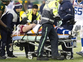 Montreal Alouettes Michael Klassen (90) is taken away on a stretcher while playing against the Edmonton Eskimos during second half action in Edmonton, Alta., on Sunday November 1, 2015.