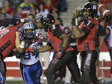 Montreal Alouettes' Michael Sam (94) tries to disrupt the Ottawa Redblacks offence during the first half of a CFL game in Ottawa on Friday, Aug. 7, 2015.
