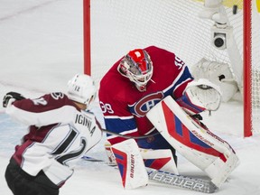 Canadiens goaltender Mike Condon makes a save against Colorado Avalanche's Jerome Iginla during first period NHL hockey action in Montreal on Saturday, Nov. 14, 2015.