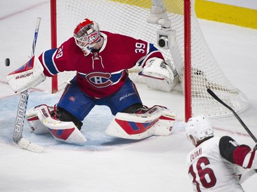 Arizona Coyotes' Max Domi takes a shot on Montreal Canadiens goaltender Mike Condon during third period NHL hockey action in Montreal, Thursday, November 19, 2015.