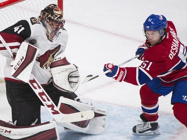 Arizona Coyotes goaltender Mike Smith makes a save against Montreal Canadiens' David Desharnais during third period NHL hockey action in Montreal, Thursday, November 19, 2015.