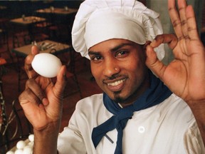 A cook at Eggspectation, Kumanamenon Manikam, shows his love for the egg in this file photo.