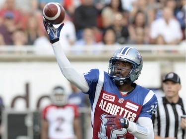 Montreal Alouettes quarterback Rakeem Cato throws for a touchdown against the Calgary Stampeders during first half CFL football action in Montreal, Friday July 3, 2015.