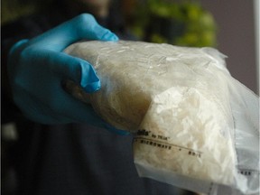 File photo: Montreal police hold approximately one kilo of seized crystal meth.