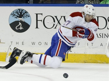 Montreal Canadiens centre Alex Galchenyuk (27) passes off the puck against the New York Rangers during the first period of an NHL hockey game, Wednesday, Nov. 25, 2015, in New York.