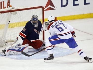 Montreal Canadiens left wing Max Pacioretty (67) scores against New York Rangers goalie Henrik Lundqvist (30) during the third period of an NHL hockey game Wednesday, Nov. 25, 2015, in New York. The Canadiens won 5-1.