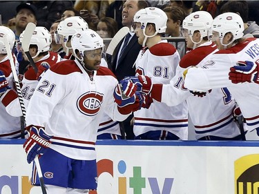 Montreal Canadiens right wing Devante Smith-Pelly (21) is greeted by teammates after he scored a goal against the New York Rangers during the second period of an NHL hockey game Wednesday, Nov. 25, 2015, in New York.