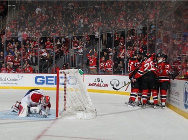 The New Jersey Devils celebrate a power-play goal by Lee Stempniak #20 at 9:06 of the second period against Mike Condon #39 of the Montreal Canadiens at the Prudential Center on November 27, 2015 in Newark, New Jersey.