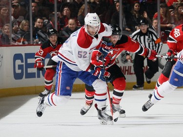 Bud Holloway #52 of the Montreal Canadiens skates in his first NHL game against the New Jersey Devils at the Prudential Center on November 27, 2015 in Newark, New Jersey.