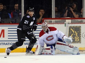 Islanders' Kyle Okposo attempts to control the puck in front of Canadiens goalie Carey Price during the first period at the Barclays Center on November 20, 2015, in Brooklyn.