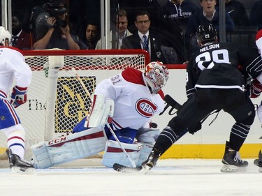 Carey Price #31 of the Montreal Canadiens makes the first period save as Brock Nelson #29 of the New York Islanders looks for the rebound at the Barclays Center on November 20, 2015, in Brooklyn.