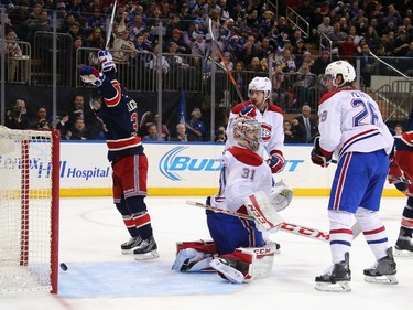 Mats Zuccarello #36 celebrates a power-play goal by Ryan McDonagh #27 of the New York Rangers at 17:42 of the second period against Carey Price #31 of the Montreal Canadiens at Madison Square Garden on November 25, 2015 in New York City.