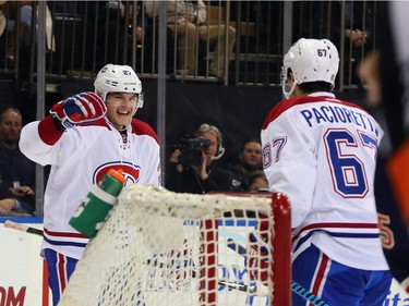 Alex Galchenyuk #27 and Max Pacioretty #67 of the Montreal Canadiens celebrate a third period goal by Pacioretty against the New York Rangers at Madison Square Garden on November 25, 2015 in New York City. The Canadiens defeated the Rangers 5-1.