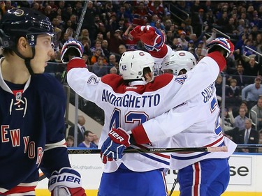 Sven Andrighetto #42 of the Montreal Canadiens (l) celebrates his goal at 4:45 of the first period along with Alex Galchenyuk #27 (r) against the New York Rangers at Madison Square Garden on November 25, 2015 in New York City.