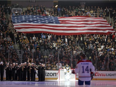 Marc-Andre Fleury of the Pittsburgh Penguins and Tomas Plekanec of the Montreal Canadiens are shown during the playing of the national anthem before Wednesday night's game in Pittsburgh.