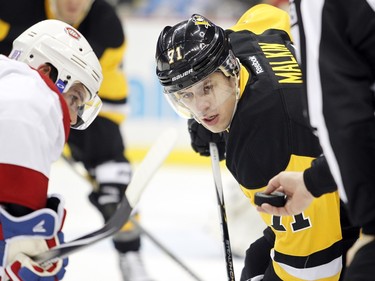 Evgeni Malkin of the Pittsburgh Penguins takes a face-off during the game against the Montreal Canadiens in Pittsburgh on Wednesday night.