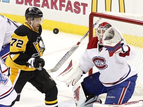 Penguins' Patric Hornqvist battles Habs goalie Mike Condon for the puck during game at Consol Energy Center on November 11, 2015 in Pittsburgh.