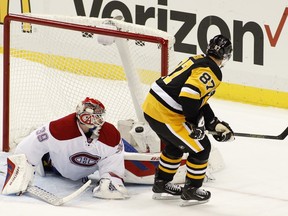 Sidney Crosby of the Pittsburgh Penguins scores on Mike Condon of the Montreal Canadiens during the shootout during the game at Consol Energy Center on November 11, 2015 in Pittsburgh.