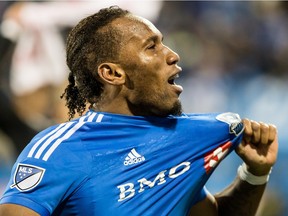 Impact forward Didier Drogba celebrates after 2-1 playoff win over Toronto FC at Montreal's Saputo Stadium on Oct. 29, 2015.
