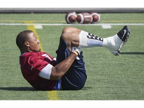 MONTREAL, QUE.: August 24, 2015 -- Montreal Alouettes defensive end John Bowman stretches during practice in Montreal Monday August 24, 2015. (John Mahoney / MONTREAL GAZETTE)