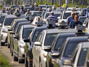 Protesting taxi drivers in Montreal in August 2015. The drivers are unhappy with Uber and other alternate travel options operating in Montreal.