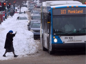 A woman rushes for a bus on Monkland Ave. in the NDG area of Montreal Saturday, December 29, 2012.
