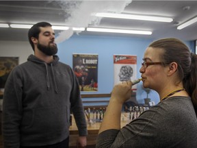 Manager Stacy Pomerleau and employee Josh Steingue vape at Robot Vapes in Montreal Wednesday January 21, 2015.