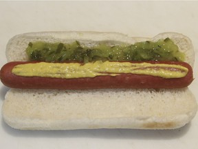 Steamed hotdog with mustard and relish at Paul Patates in the Pointe St. Charles district of Montreal Thursday January 22, 2015.