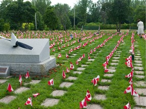 The National Field of Honour cemetery in Pointe-Claire. Students from Vincent-Massey School will place 500 poppies on the grave markers at 11 a.m.