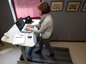 Jill Barker at a treadmill workstation in 2013. Not all employers are ready to embrace a workplace that looks like a gym