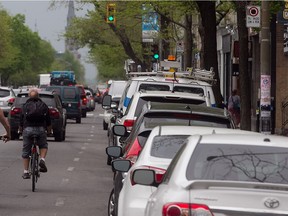 MONTREAL, QUE.: MAY 22, 2014 -- Cyclists makes their way South on St Denis near Rachel in the Plateau on Thursday May 22, 2014. The Plateau-Mont-Royal borough announces road-safety measures. They are reducing the speed limit on major streets like St-Denis to 40 km/h (from 50). (Pierre Obendrauf / THE GAZETTE) ORG XMIT: 50044-0007