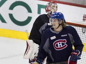 Canadiens goalie Mike Condon gives teammate Jeff Petry the eye after Petry scored against him during team practice at the Bell Sports Complex in Montreal on Tuesday November 10, 2015.
