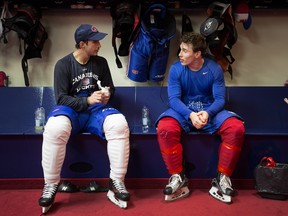 Canadiens' Brian Flynn (left) and Brendan Gallagher chat in the locker room after a team practice at the Bell Sports Complex in Brosard on Nov. 10 2015.