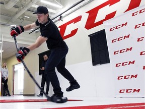 Colorado Avanlanche forward Matt Duchene shoots a puck with a hockey fitted with reflective markers at the CCM Performance Lab in Montreal on Friday Nov.13, 2015.