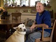 Animator Sheldon Cohen with his dog, Gracie, in his home.