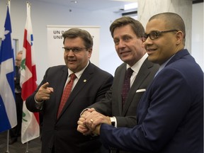 File photo: Montreal Mayor Denis Coderre, Quebec minister of public safety Pierre Moreau and Herman Deparice-Okomba, director for the centre for the prevention of radicalization leading to violence, at the centre's official opening in Montreal on Sunday.