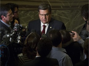 Montreal Mayor Denis Coderre speaks to media outside an ongoing  Montreal city council meeting on Monday, Nov. 23, 2015.